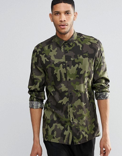 tendances-chemises-automne-hiver-2016-2017-camouflage-imprimé "largeur =" 600 "hauteur =" 766 "srcset =" https://modaellos.com/wp-content/uploads/2016/03/tendencia-camisas -tonone-hiver-2016-2017-stamped-camouflage.jpg 513w, https://modaellos.com/wp-content/uploads/2016/03/tendencia-camisas-otono-invierno-2016-2017-stampado-camuflaje- 250x319.jpg 250w "tailles =" (largeur max: 600px) 100vw, 600px "/></noscript><div class=